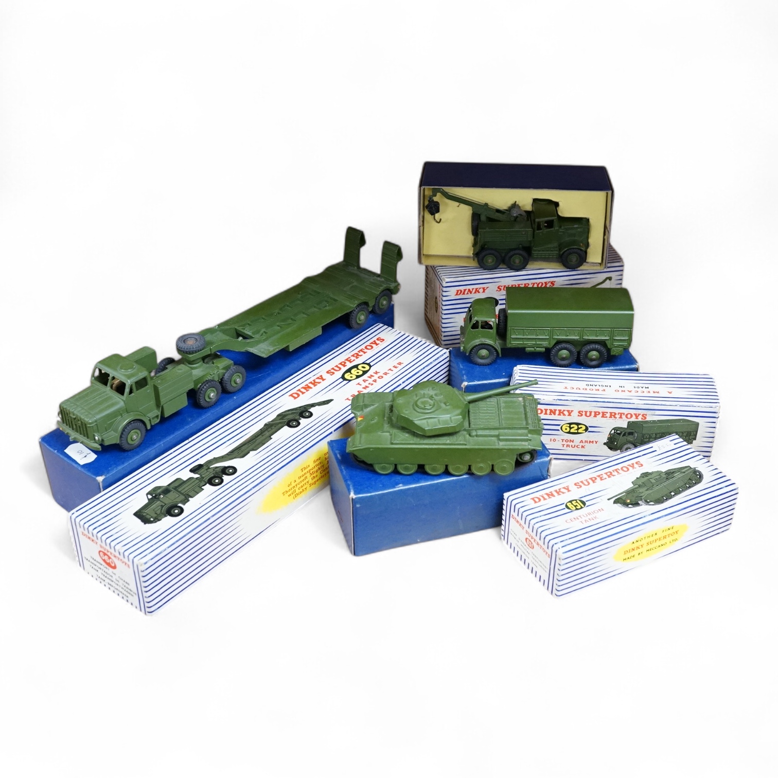 Four boxed Dinky Toys military vehicles; Mighty Antar tank transporter (660), Centurion tank (651), Recovery Tractor (661), and 10-ton Army Truck (622). Condition - fair to good, vehicles generally very good, minor wear